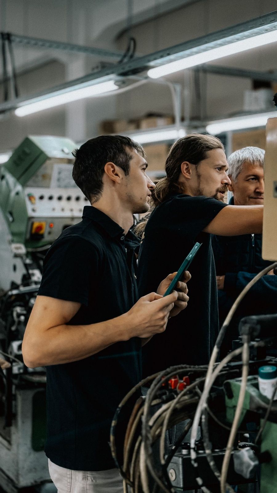 Engineers reviewing tooling on the production floor